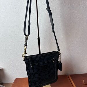 Coach Black Signature Crossbody
Bag with brass hardware